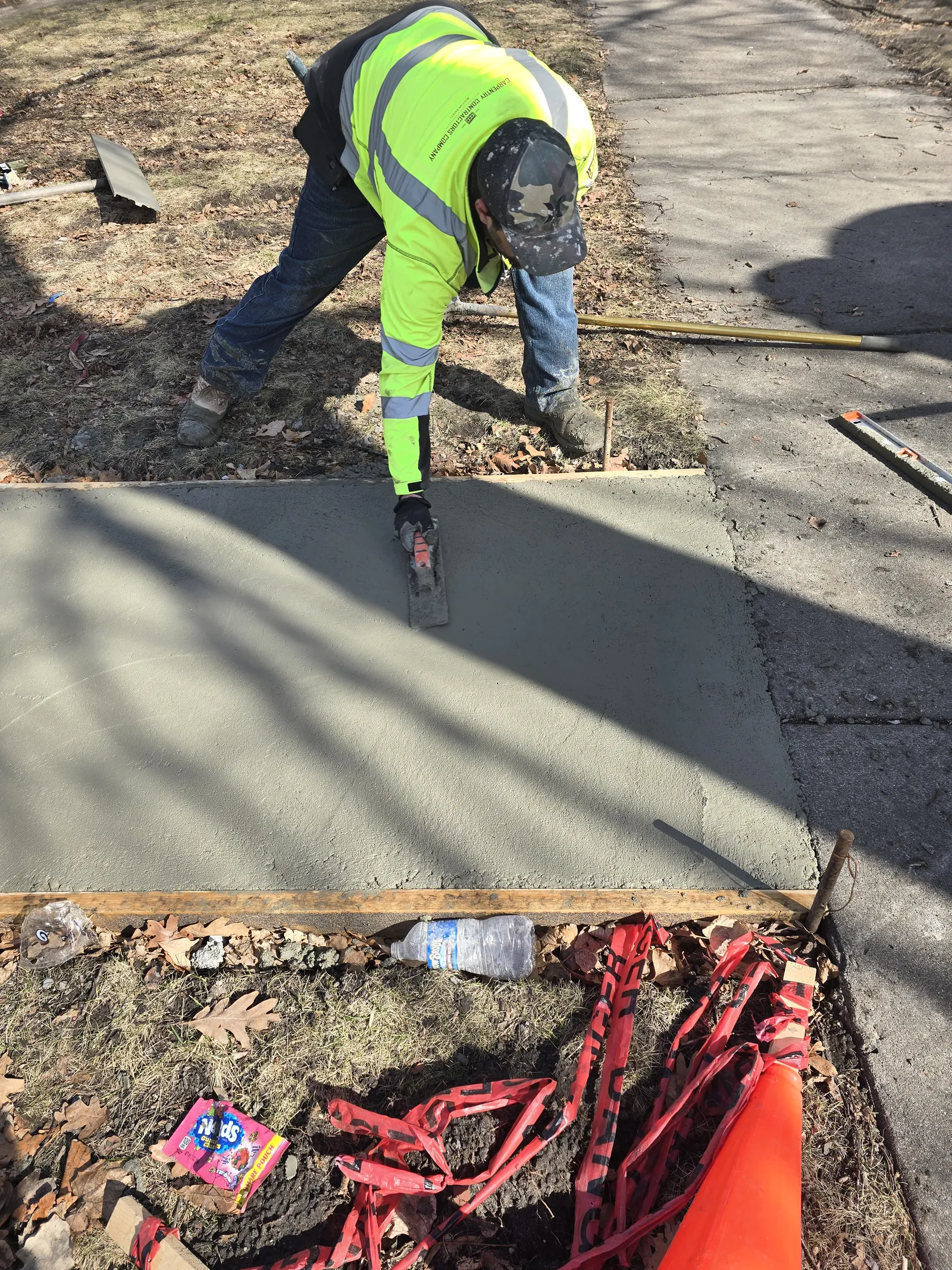 Omega Concrete crew pouring and finishing fresh concrete
